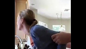 Mature Woman Engaging In Sexual Activity In The Kitchen