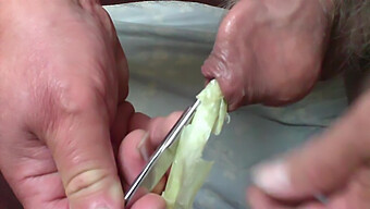 Toying Foreskin With Spring Onion And Scissors In Homemade Video